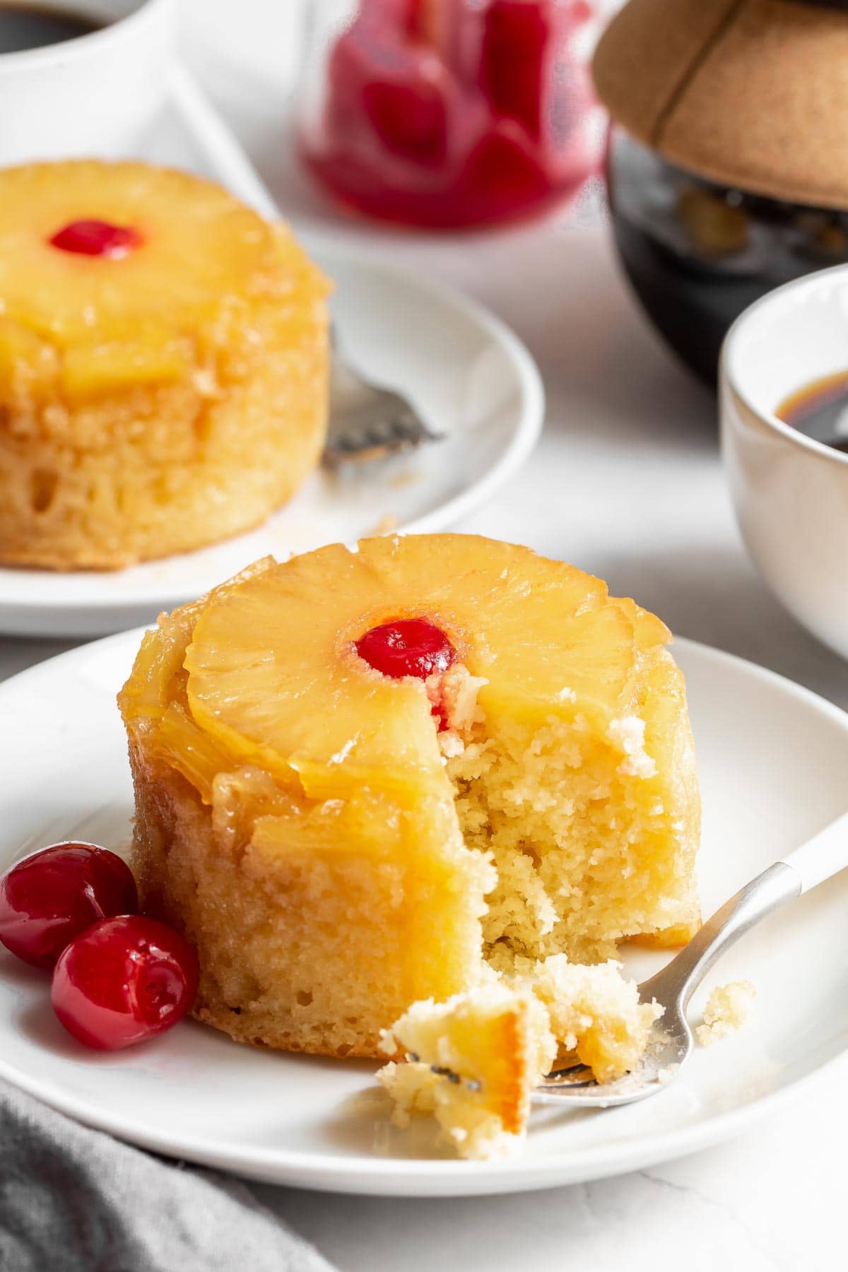 Pineapple upside down cake with fork taking a bite.