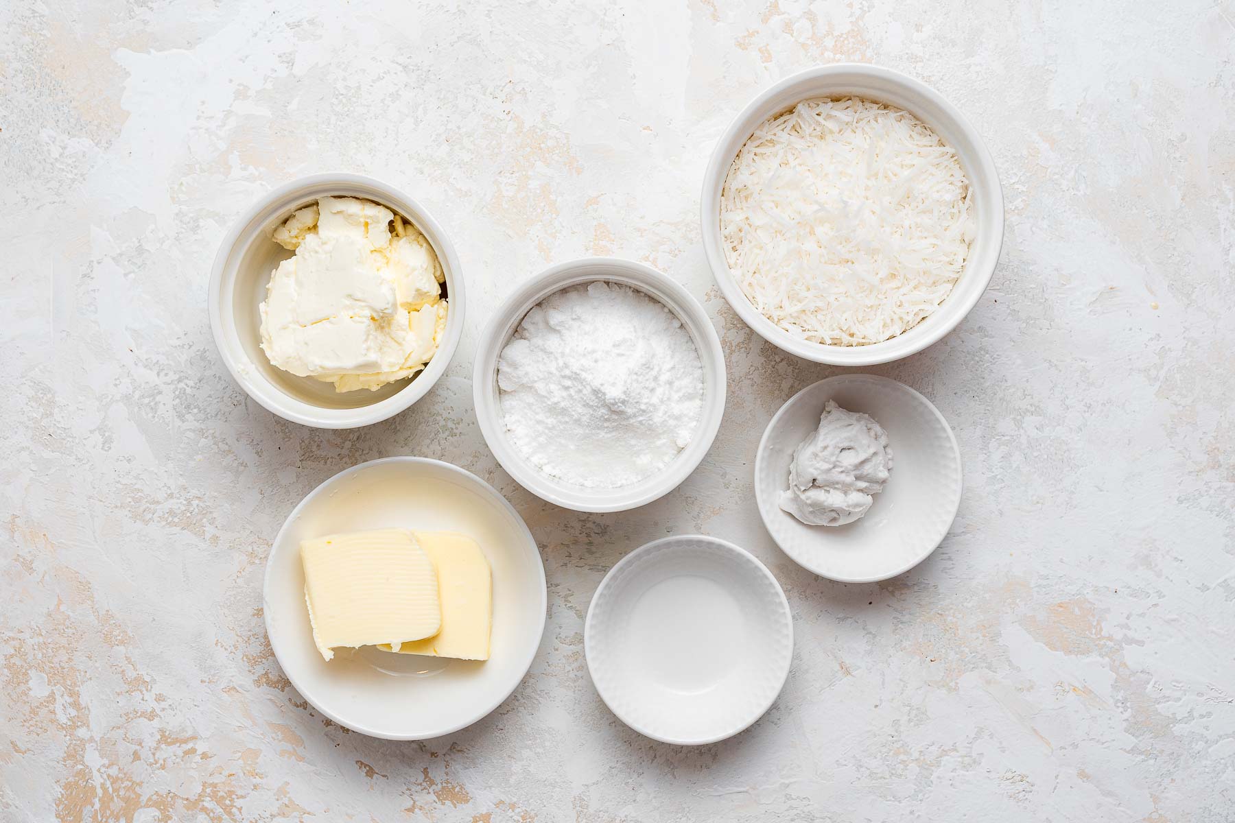 Ingredients for coconut cream cheese frosting.