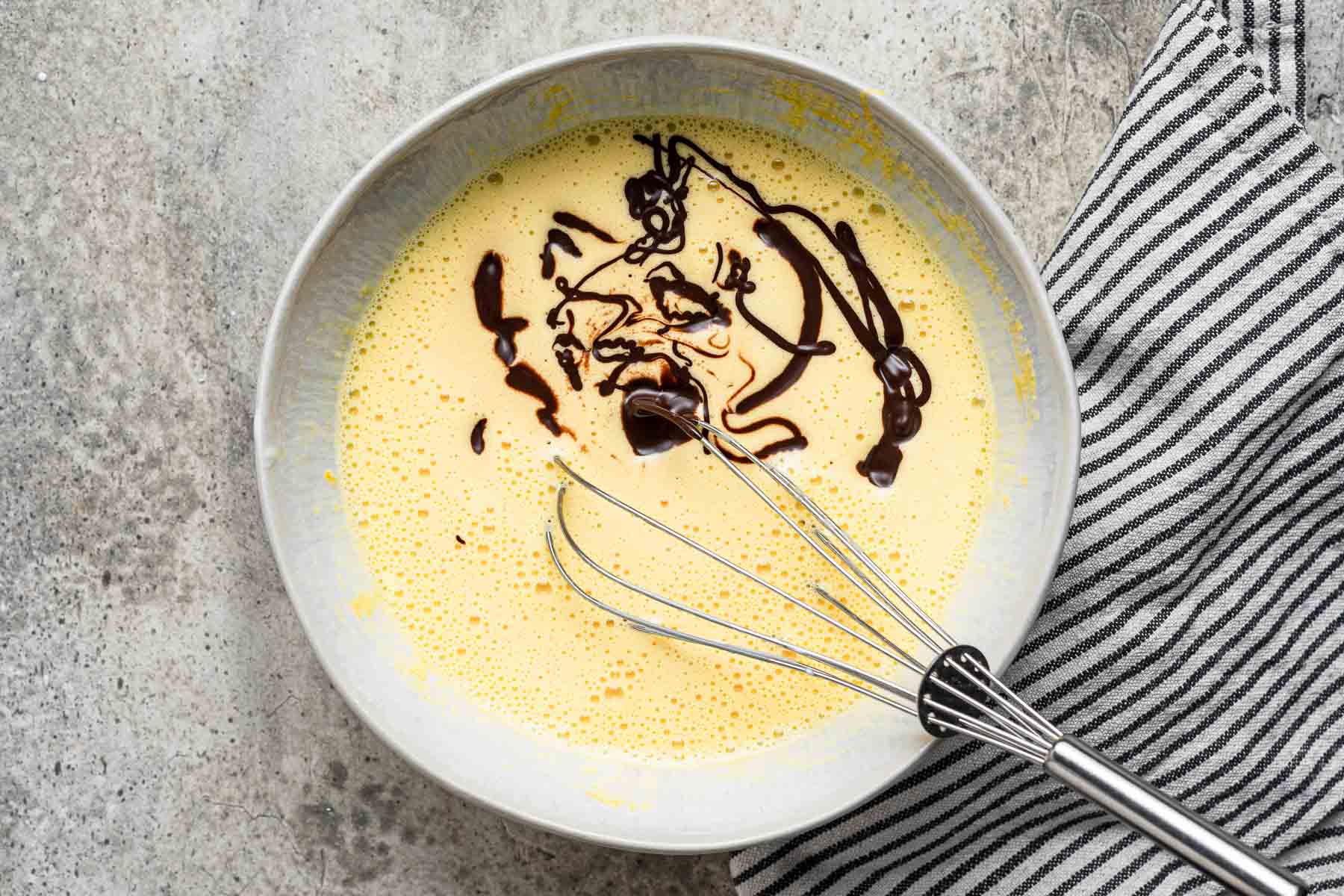 Melted chocolate poured into custard mixture.