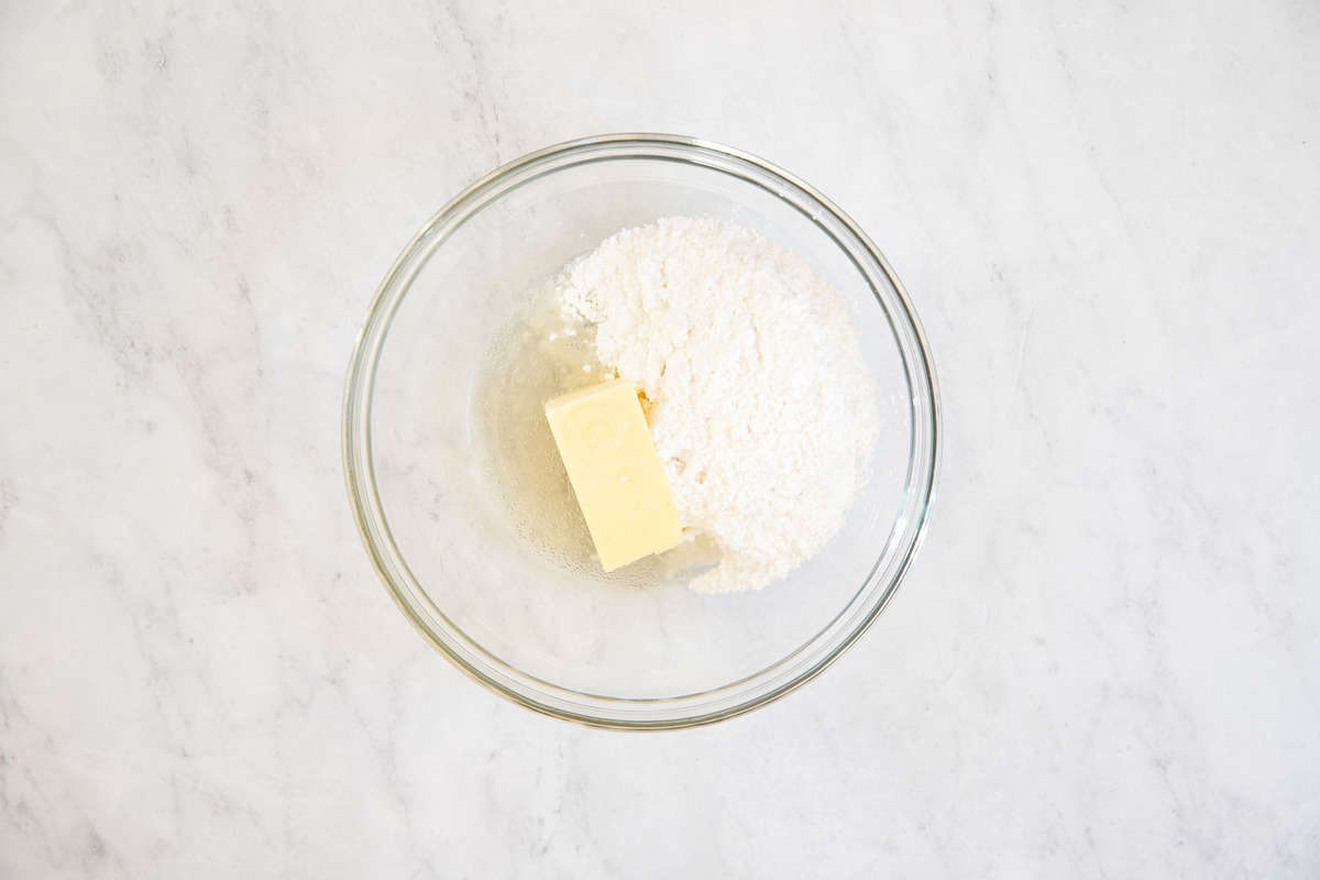 Champagne buttercream ingredients in a bowl.