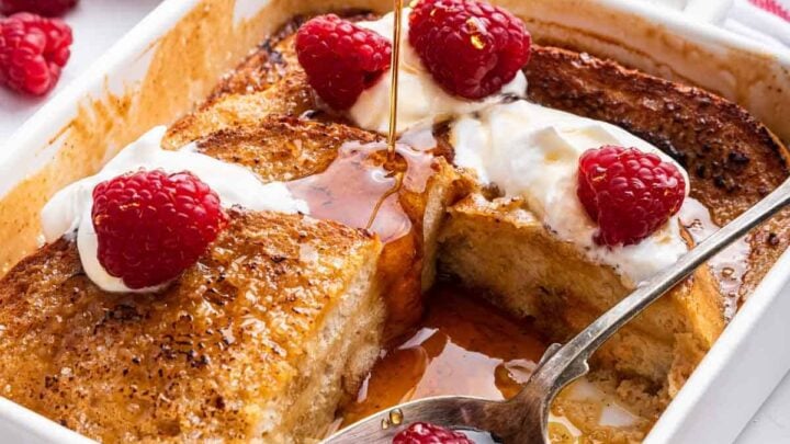 Pan of creme brulee French toast with one piece removed.