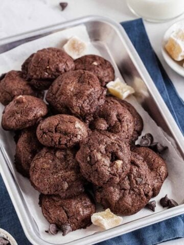 Chocolate ginger cookies on a silver tray.
