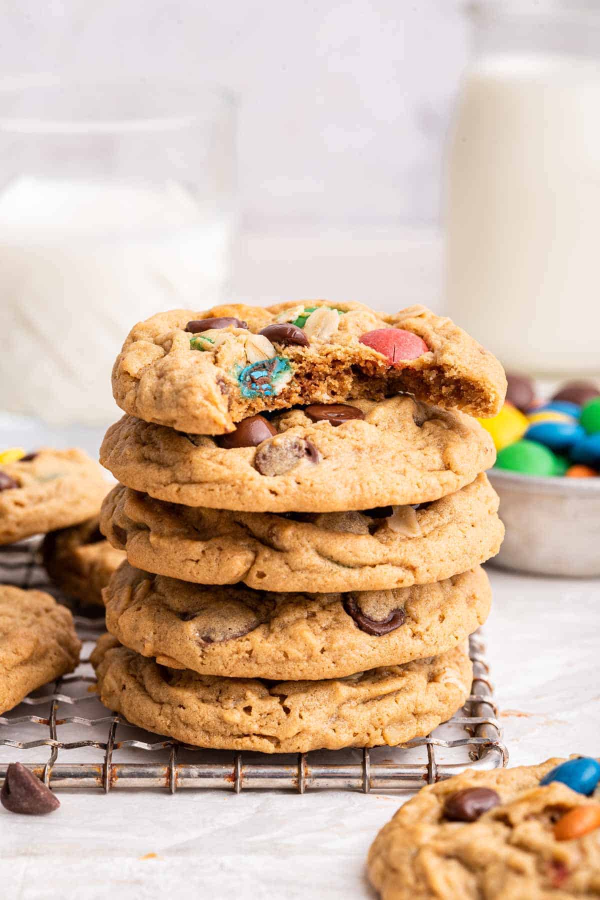 Stack of thick cookies with bite missing from top cookie.