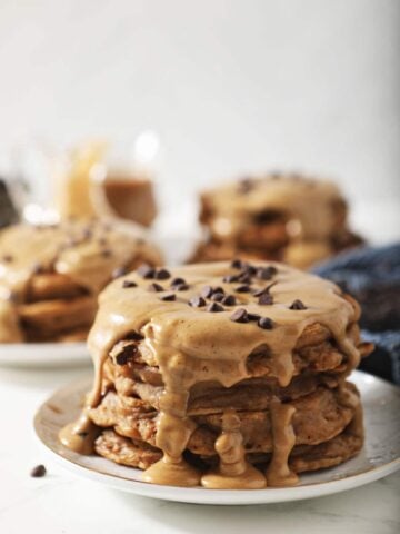Stack of coffee pancakes with mini chocolate chips on top.