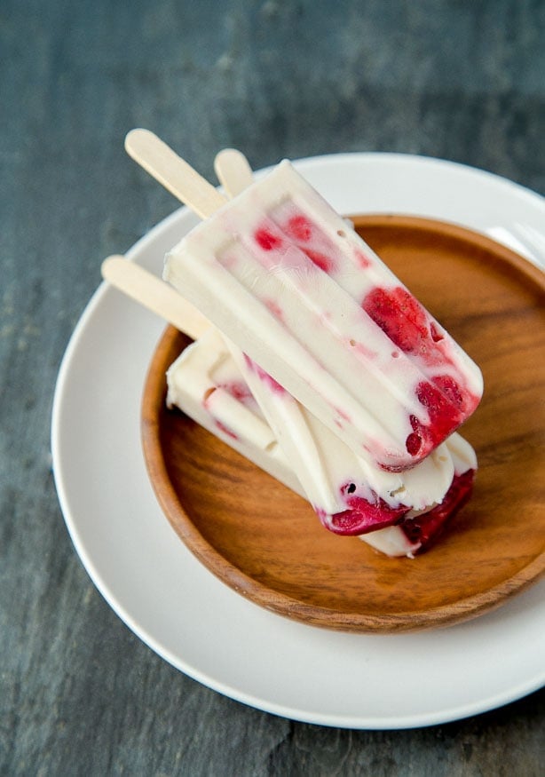 Popsicles made with Greek yogurt, roasted fruit, and agave @dessertfortwo
