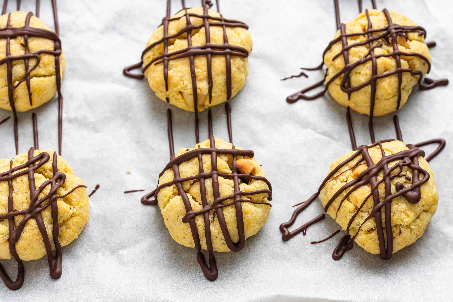 Six cookies criss-crossed with chocolate drizzle.