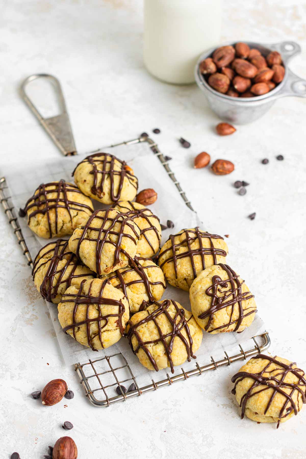 Pile of hazelnut cookies drizzled with chocolate.
