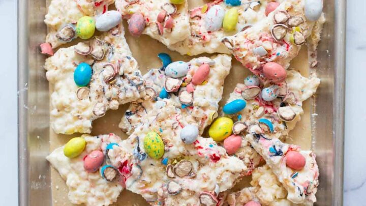 Overhead shot of colorful easter bark on silver tray.