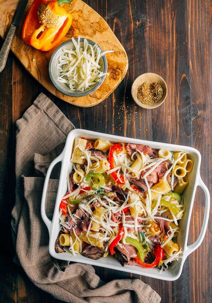 Philly Cheesesteak Pasta. Creamy baked pasta with peppers, onions, and steak.