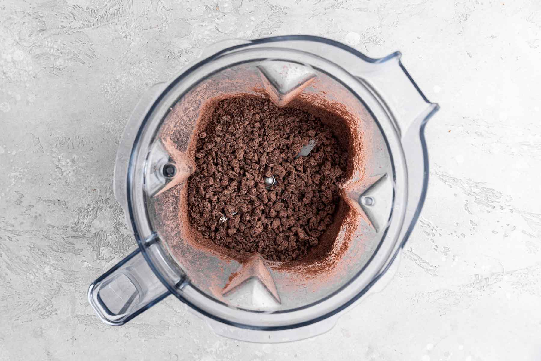 Chocolate pieces chopped finely in the bottom of a blender.
