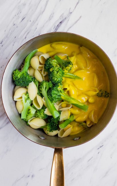 Healthy Mac and Cheese with turmeric, broccoli, and nutritional yeast. Perfect healthier version of macaroni and cheese for toddlers.