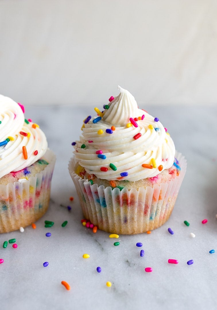 Birthday cupcakes with sprinkles--a small batch cupcake recipe for birthday cupcakes for celebrating a kids birthday party, or gifting a friend or coworker on their special day! This recipe for 4 cupcakes will come in handy