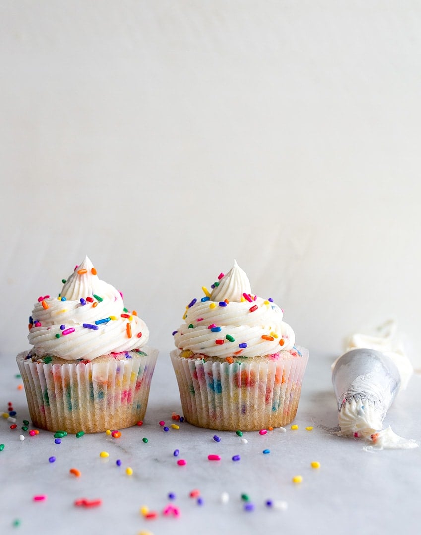 Birthday cake cupcakes with sprinkles--a small batch cupcake recipe for birthday cupcakes for celebrating a kids birthday party, or gifting a friend or coworker on their special day! This recipe for 4 cupcakes will come in handy