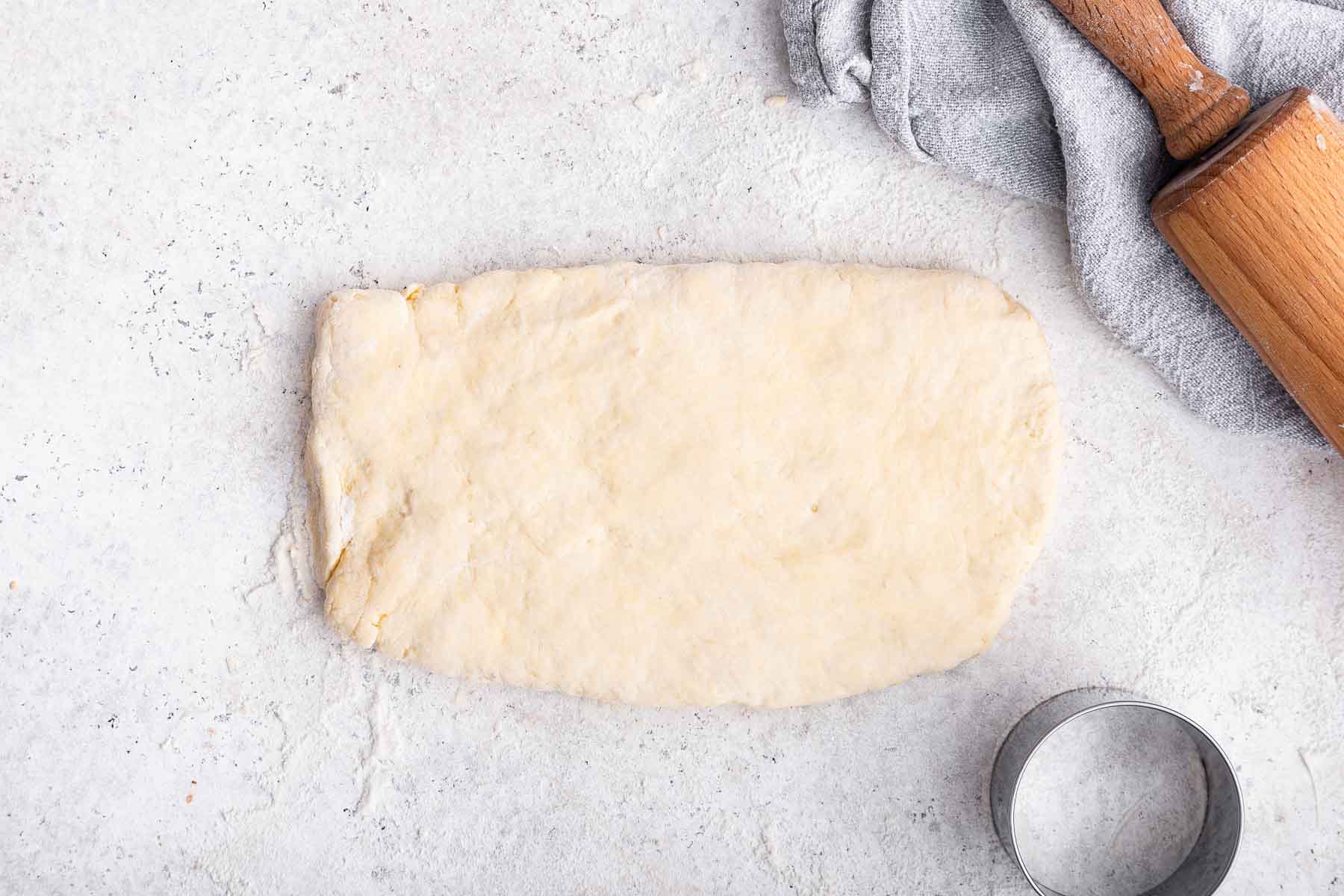 Dough pressed into 1-inch thick rectangle before being cut.