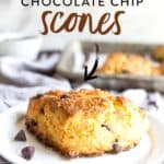 chocolate chip scone on white plate.