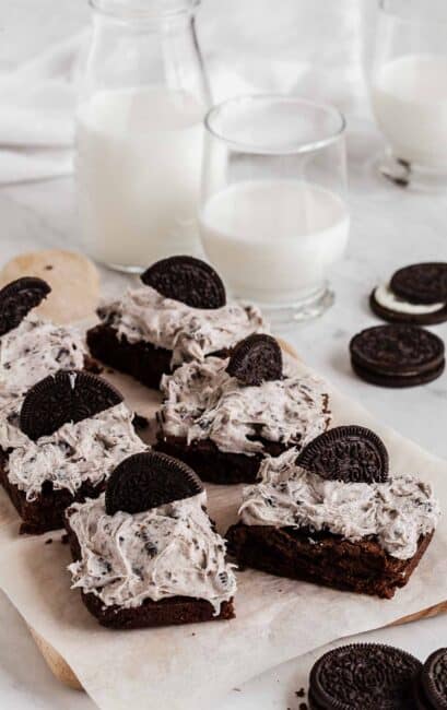 Tray with frosted oreo brownies and half oreos on top.