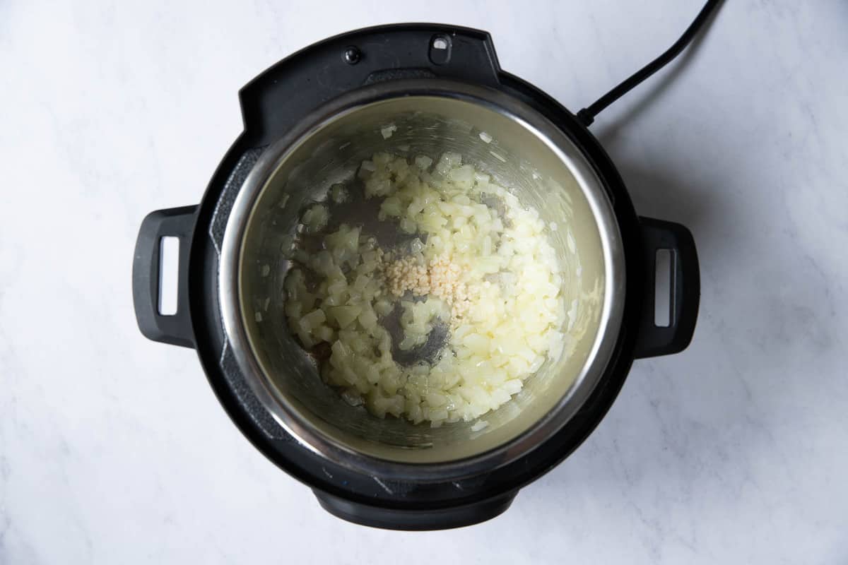 onions and garlic in the instant pot.