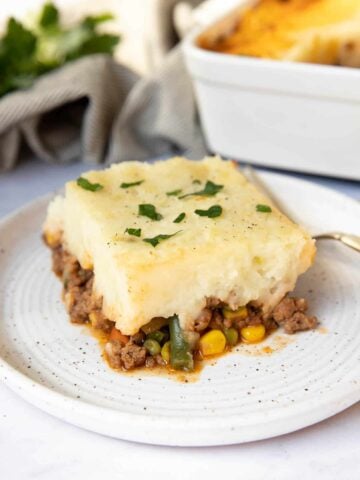 Slice of cottage pie for two on a plate.