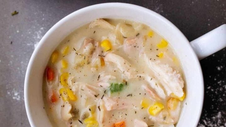 White soup mug filled with chicken pot pie with no crust.