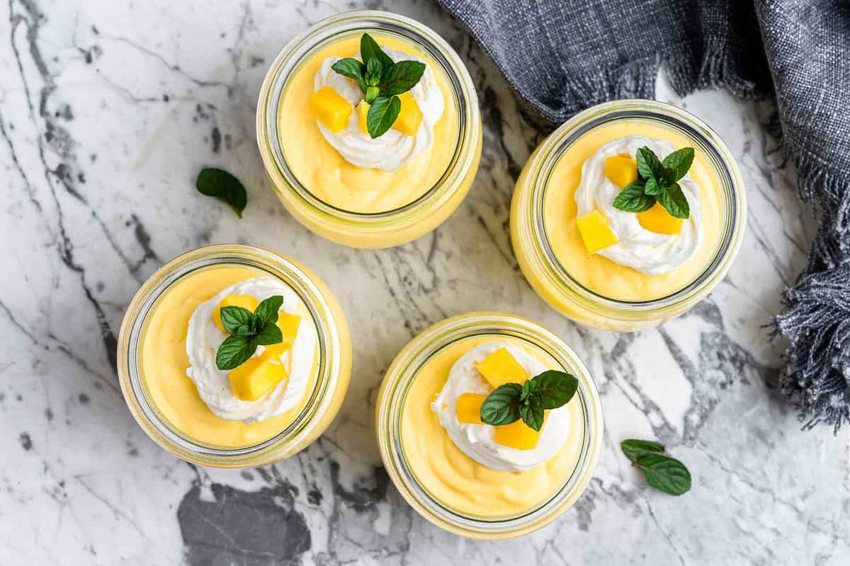 Four jars of yellow pudding.