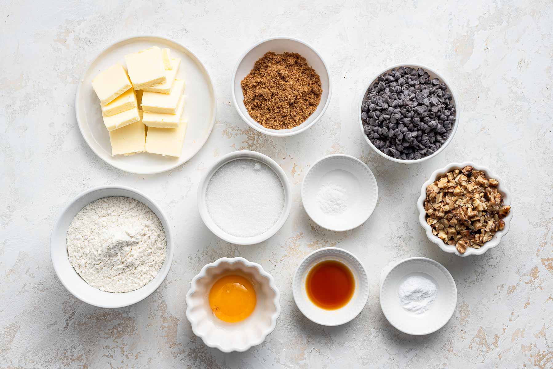 Ingredients for cookies on white table.