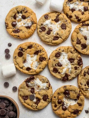 Cookies on a plate with chocolate chips and marshmallows.