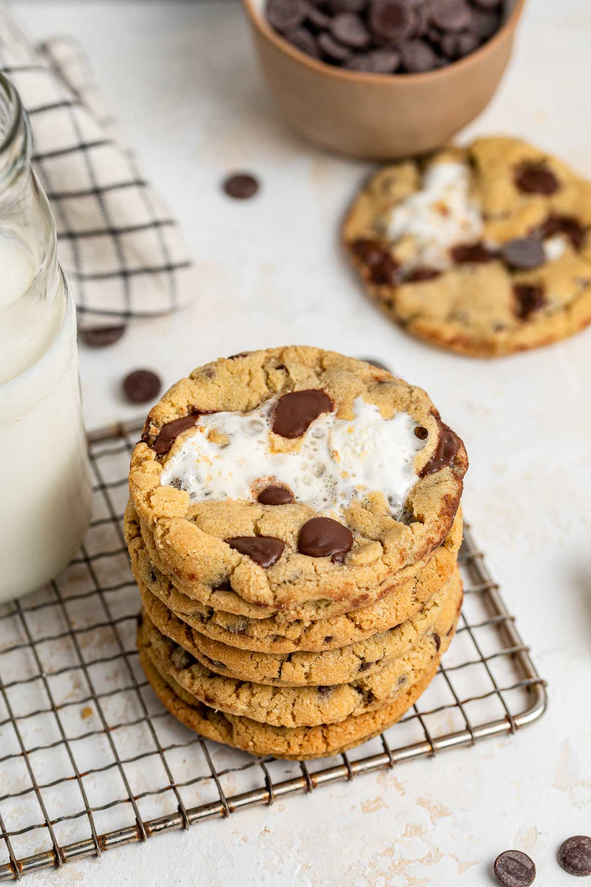 Stack of cookies with melted marshmallow in center.