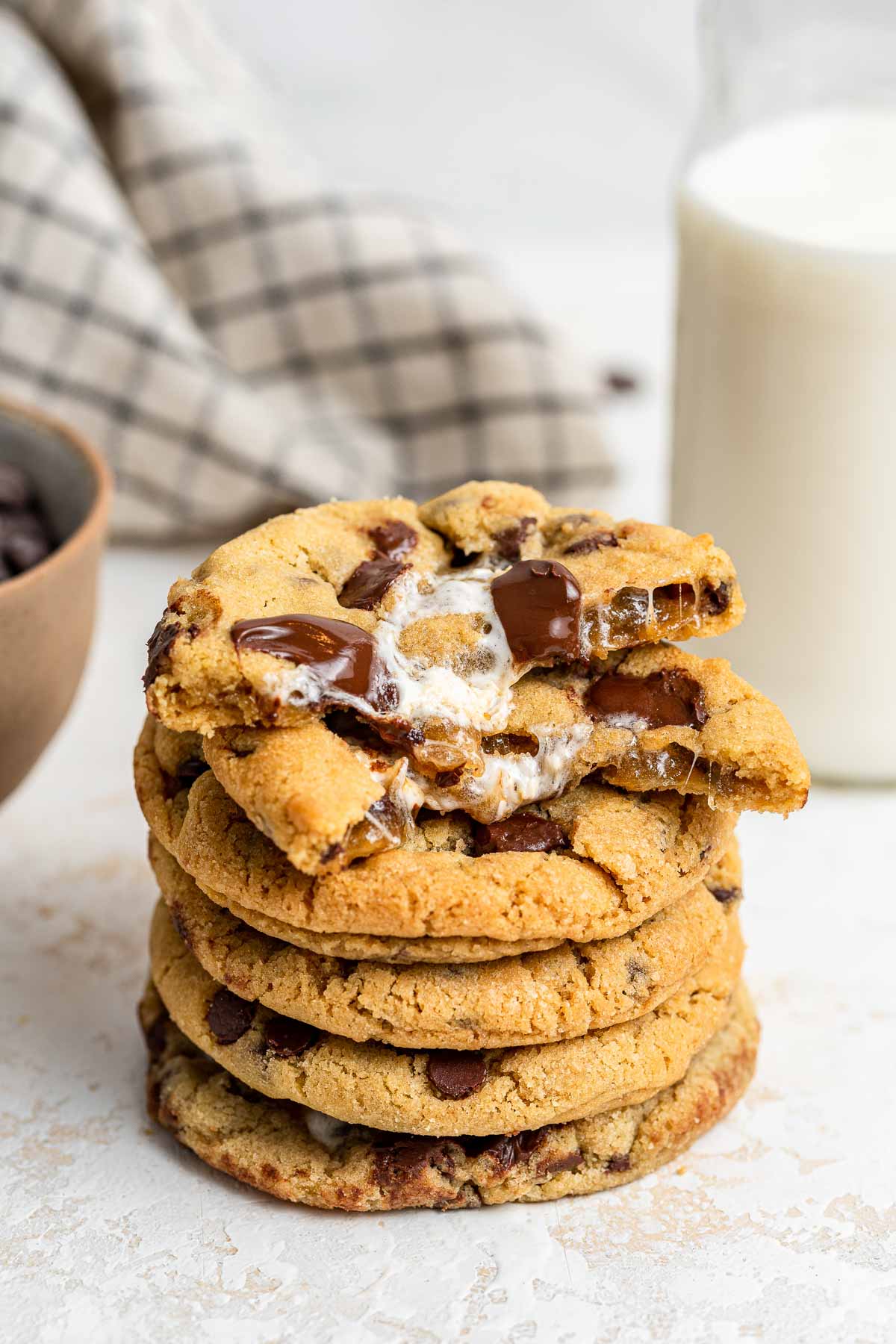 Stack of chocolate chip cookies with marshmallow centers.