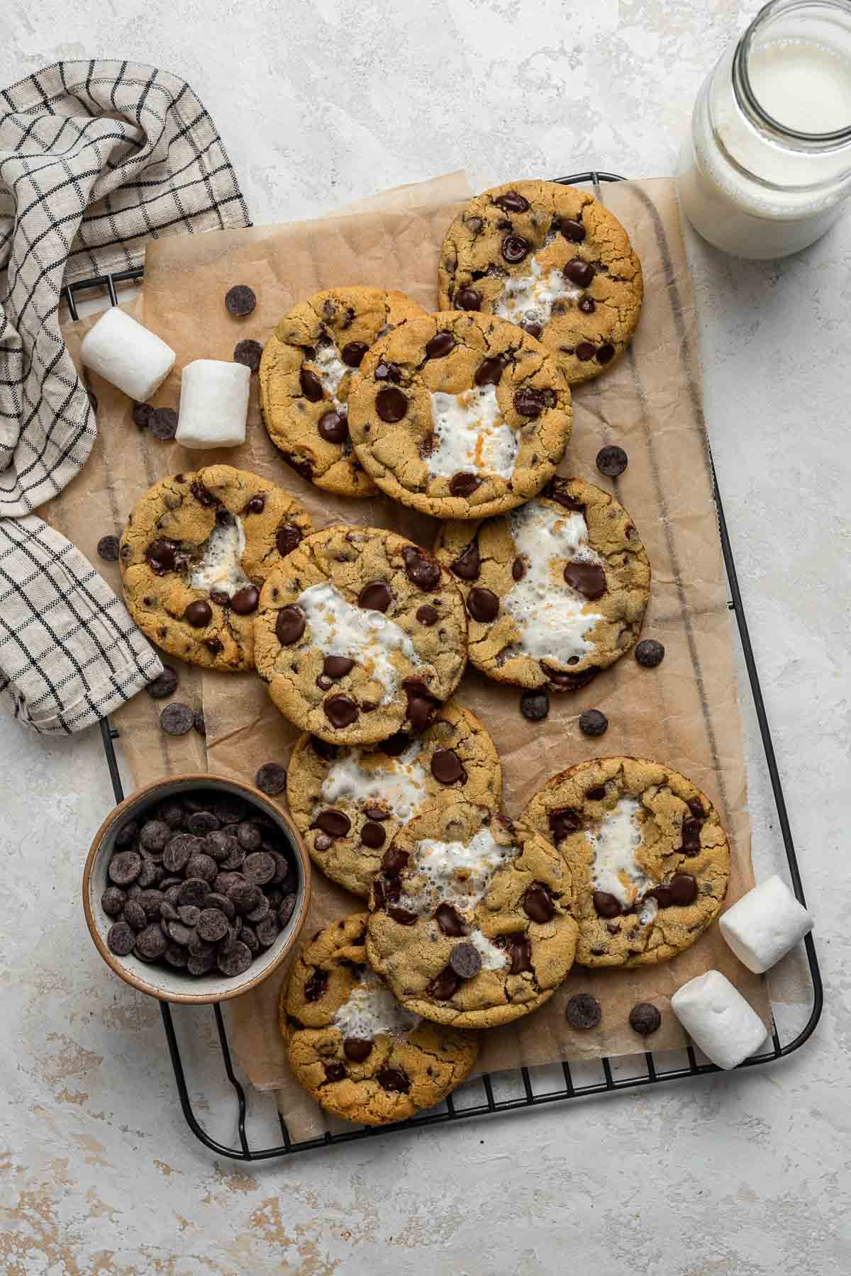 Chocolate chip cookies with a white melted marshmallow in the center.