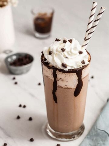 Starbucks double chocolate chip frappuccino in a glass with straw.