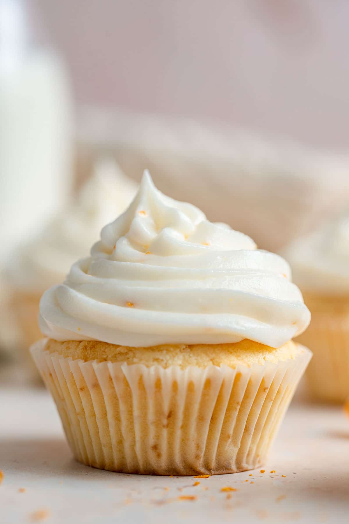 Ricotta icing recipe whipped into frosting piped on cupcake.