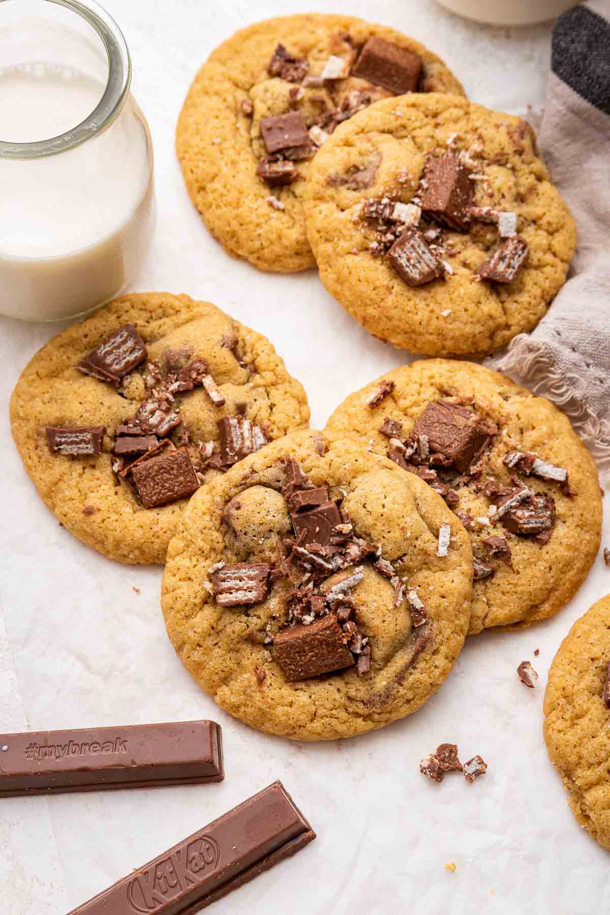 Vertical shot of cookies topped with chopped chocolate candy.