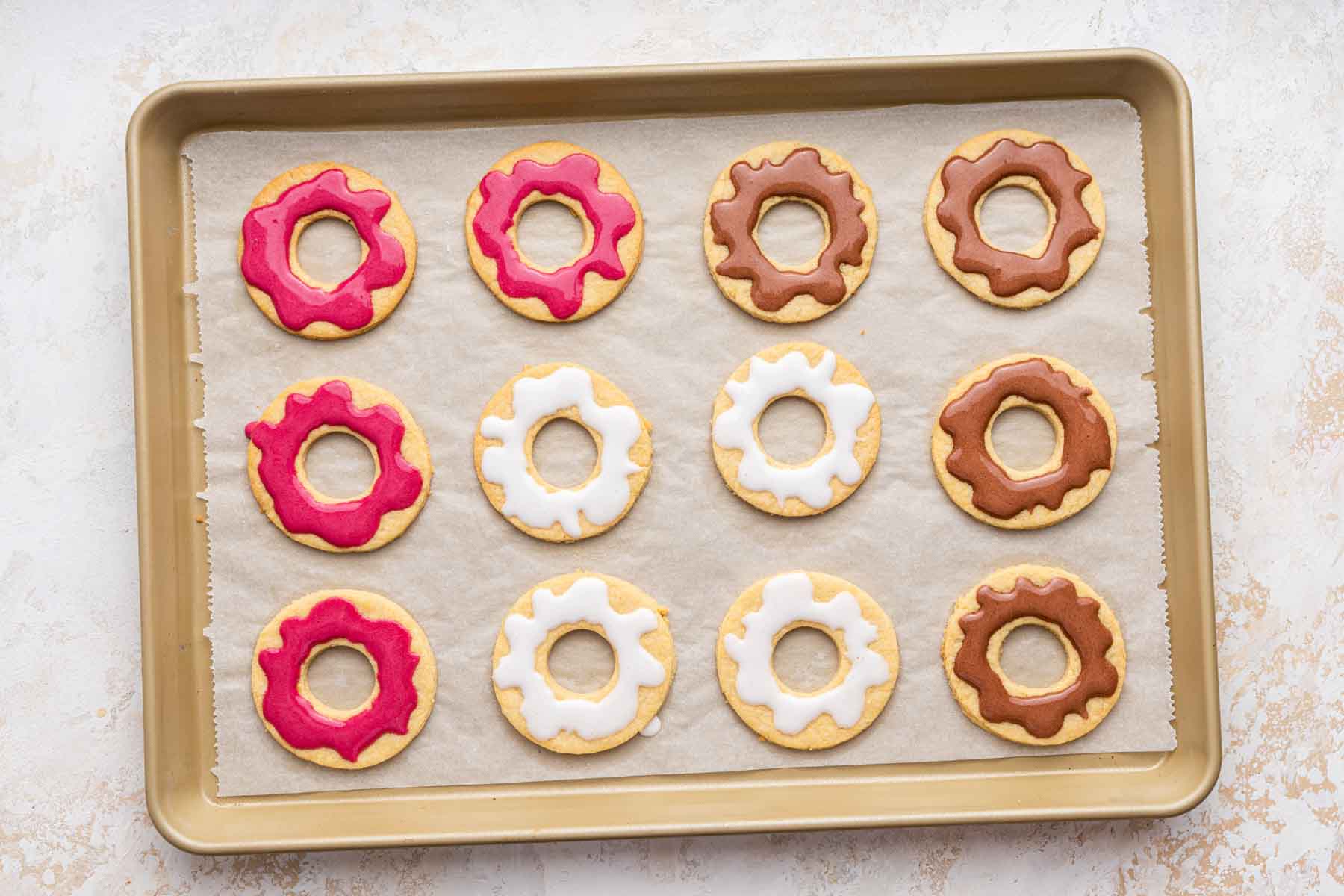 Donut cookies decorated with frosting.