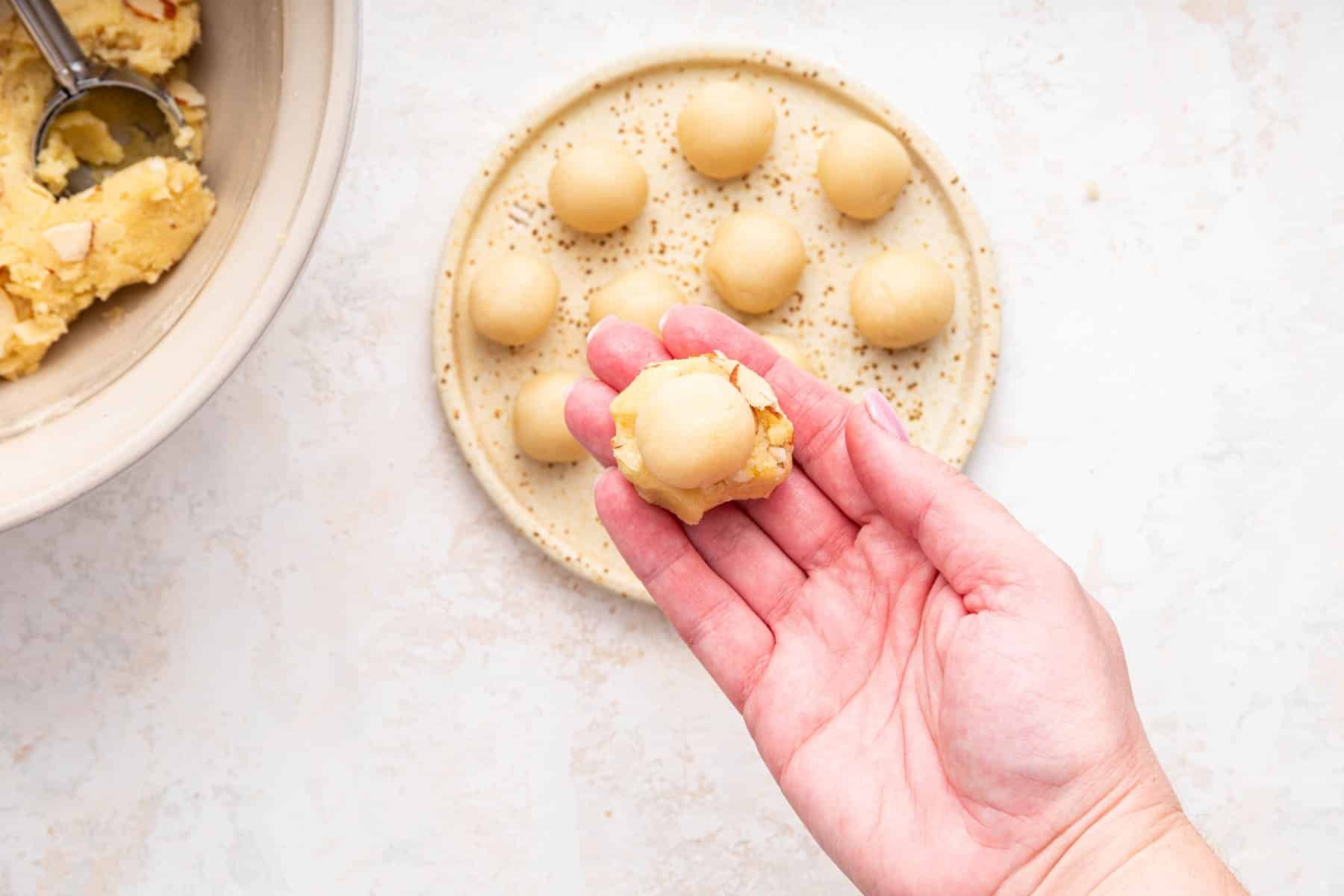 How to stuff almond paste inside a cookie with hand.