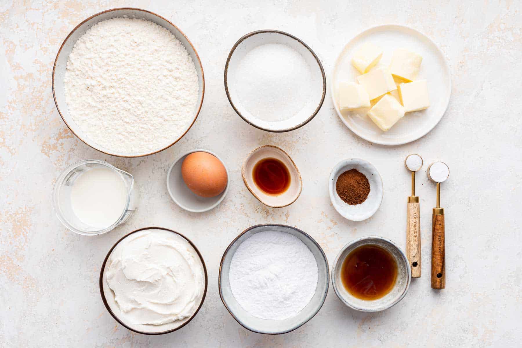 Small bowls of flour, sugar, egg, butter and espresso powder.